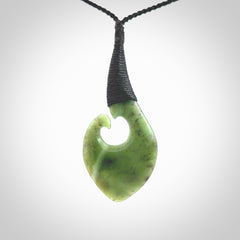 Hand carved jade koru pendant. Hand made in New Zealand by Donna Summers.
