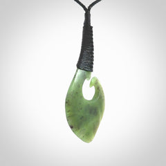 Hand carved jade koru pendant. Hand made in New Zealand by Donna Summers.