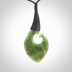 Hand carved jade koru pendant. Hand made in New Zealand by Donna Summers.