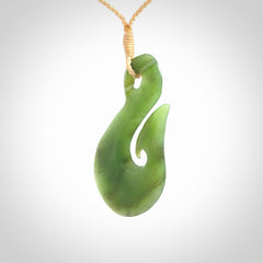 Hand carved New Zealand Jade hook pendant.