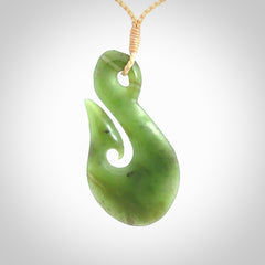 Hand carved New Zealand Jade hook pendant.