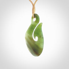 Hand carved New Zealand Jade hook pendant.