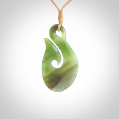 Hand carved New Zealand Jade hook pendant.