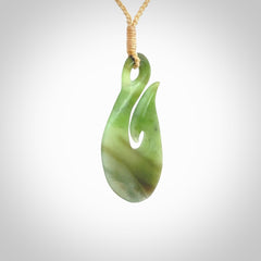 Hand carved New Zealand Jade hook pendant.