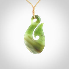 Hand carved New Zealand Jade hook pendant.
