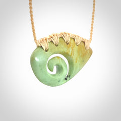 Hand carved contemporary flower jade koru jewellery. Made by Donna Summers for NZ Pacific from New Zealand greenstone.