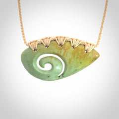 Hand carved contemporary flower jade koru jewellery. Made by Donna Summers for NZ Pacific from New Zealand greenstone.