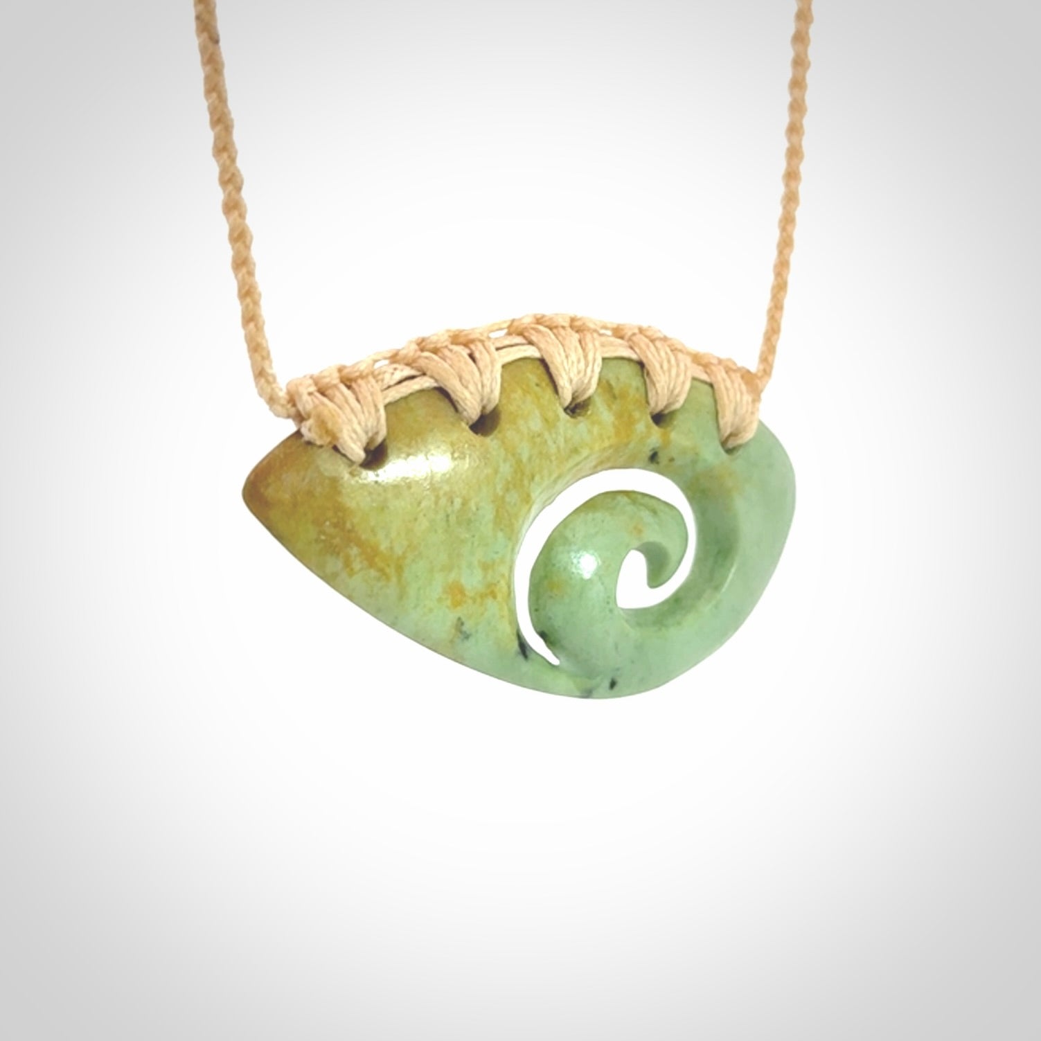 Hand carved contemporary flower jade koru jewellery. Made by Donna Summers for NZ Pacific from New Zealand greenstone.