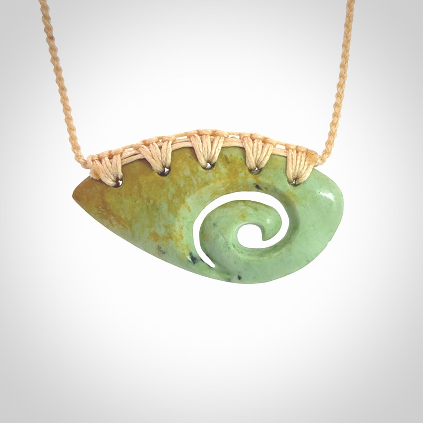 Hand carved contemporary flower jade koru jewellery. Made by Donna Summers for NZ Pacific from New Zealand greenstone.