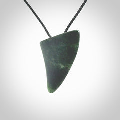 This is a lovely New Zealand Jade, pounamu drop pendant. It is bound with an adjustable Black coloured cord which is length adjustable.