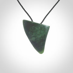 This is a lovely New Zealand Jade, pounamu drop pendant. It is bound with an adjustable Black coloured cord which is length adjustable.