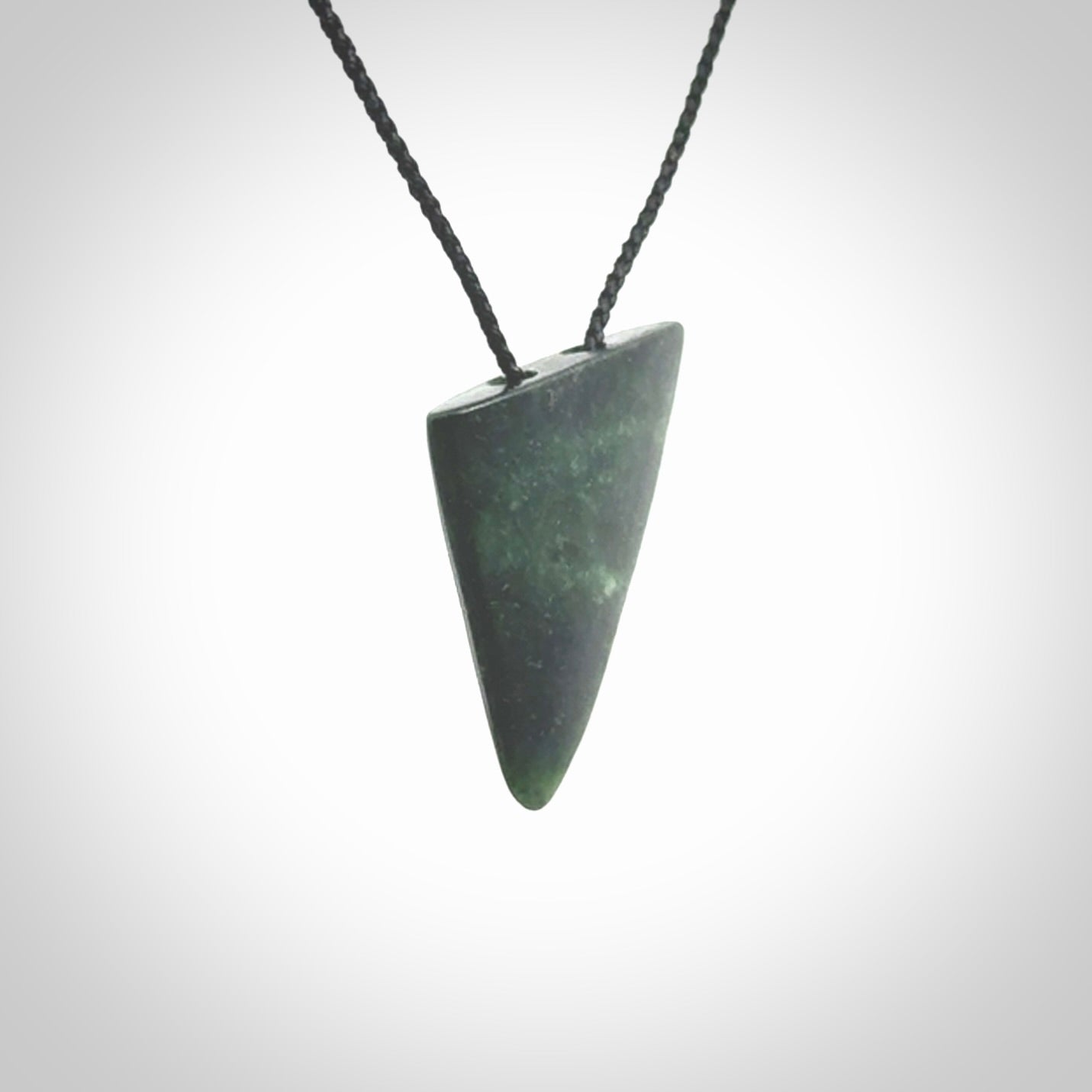 This is a lovely New Zealand Jade, pounamu drop pendant. It is bound with an adjustable Black coloured cord which is length adjustable.