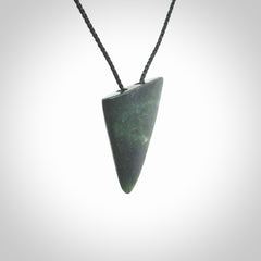 This is a lovely New Zealand Jade, pounamu drop pendant. It is bound with an adjustable Black coloured cord which is length adjustable.