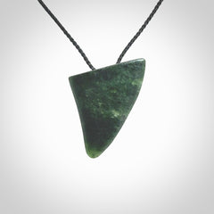 This is a lovely New Zealand Jade, pounamu drop pendant. It is bound with an adjustable Black coloured cord which is length adjustable.