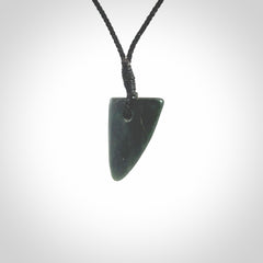 This is a lovely New Zealand Jade, pounamu drop pendant. It is bound with an adjustable Black coloured cord which is length adjustable.