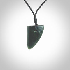 This is a lovely New Zealand Jade, pounamu drop pendant. It is bound with an adjustable Black coloured cord which is length adjustable.