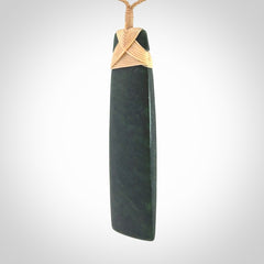Hand carved from a lovely piece of local New Zealand Jade. We have suspended this from a 3-plait beige cord which can be adjusted with a couple of slip knots.