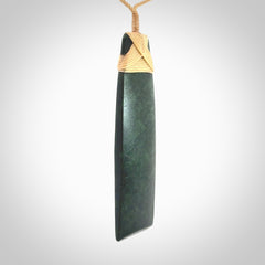 Hand carved from a lovely piece of local New Zealand Jade. We have suspended this from a 3-plait beige cord which can be adjusted with a couple of slip knots.