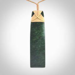 Hand carved from a lovely piece of local New Zealand Jade. We have suspended this from a 3-plait beige cord which can be adjusted with a couple of slip knots.