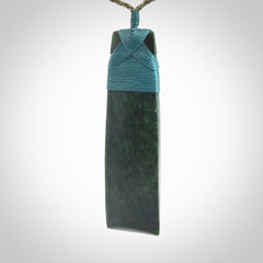 Hand carved from a lovely piece of local New Zealand Jade. We have suspended this from a olive cord which can be adjusted with a couple of slip knots.