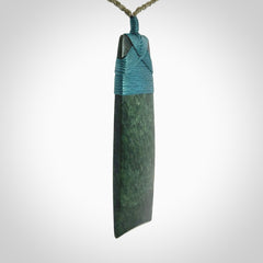 Hand carved from a lovely piece of local New Zealand Jade. We have suspended this from a olive cord which can be adjusted with a couple of slip knots.