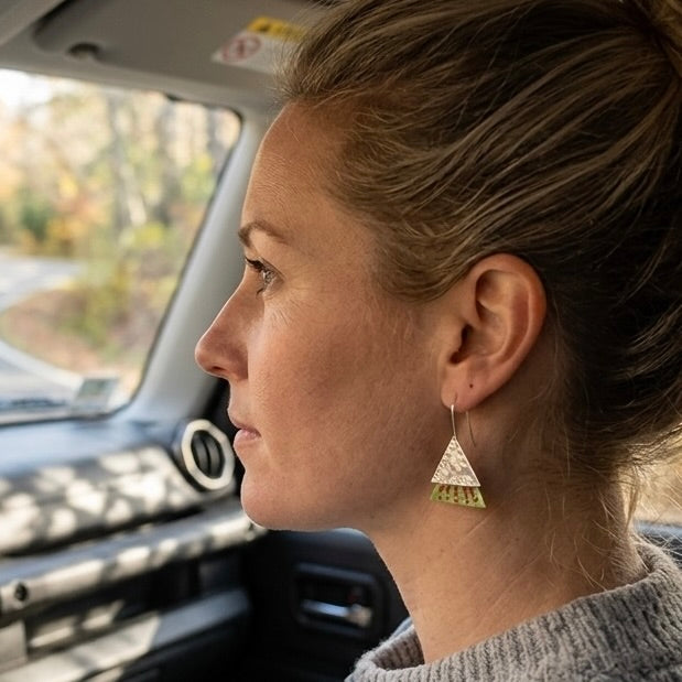 Woman wearing jade earrings with sterling silver