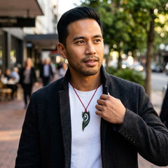 Man wearing jade pendant