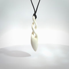 Hand carved bone double twist pendant. Beautiful hand made double twist bone necklace. Provided with an adjustable cord and packaged in a woven kete pouch. Free shipping worldwide.