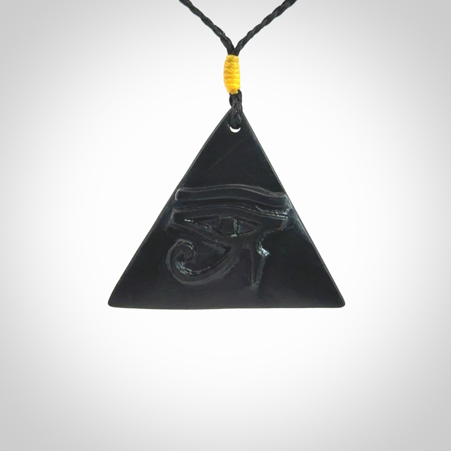 An Egyptian Eye of Ra pyramid pendant, hand made for us from Australian Black Jade. This pendant is provided with an adjustable black cord.