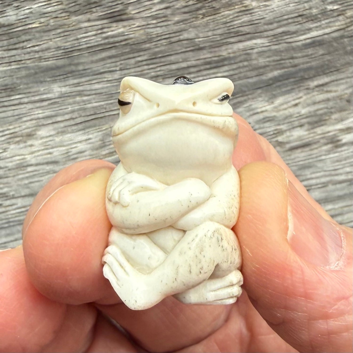 Hand carved meditating frog with slug on its head, made from Deer antler and black mother of pearl. Hand made by master bone carver Fumio Noguchi. Spectacular collectable work of art to display. One only, delivered to you at no extra cost with express courier.