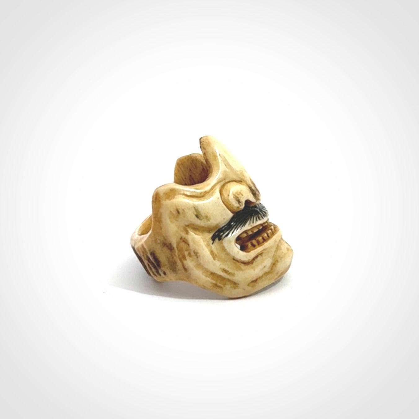 Hand carved Menpo samurai face guard ring. Made from Red Deer antler in New Zealand. Hand made from deer antler by master bone carver Fumio Noguchi. Spectacular collectable work of art, made to wear. One only ring, delivered to you with express courier.