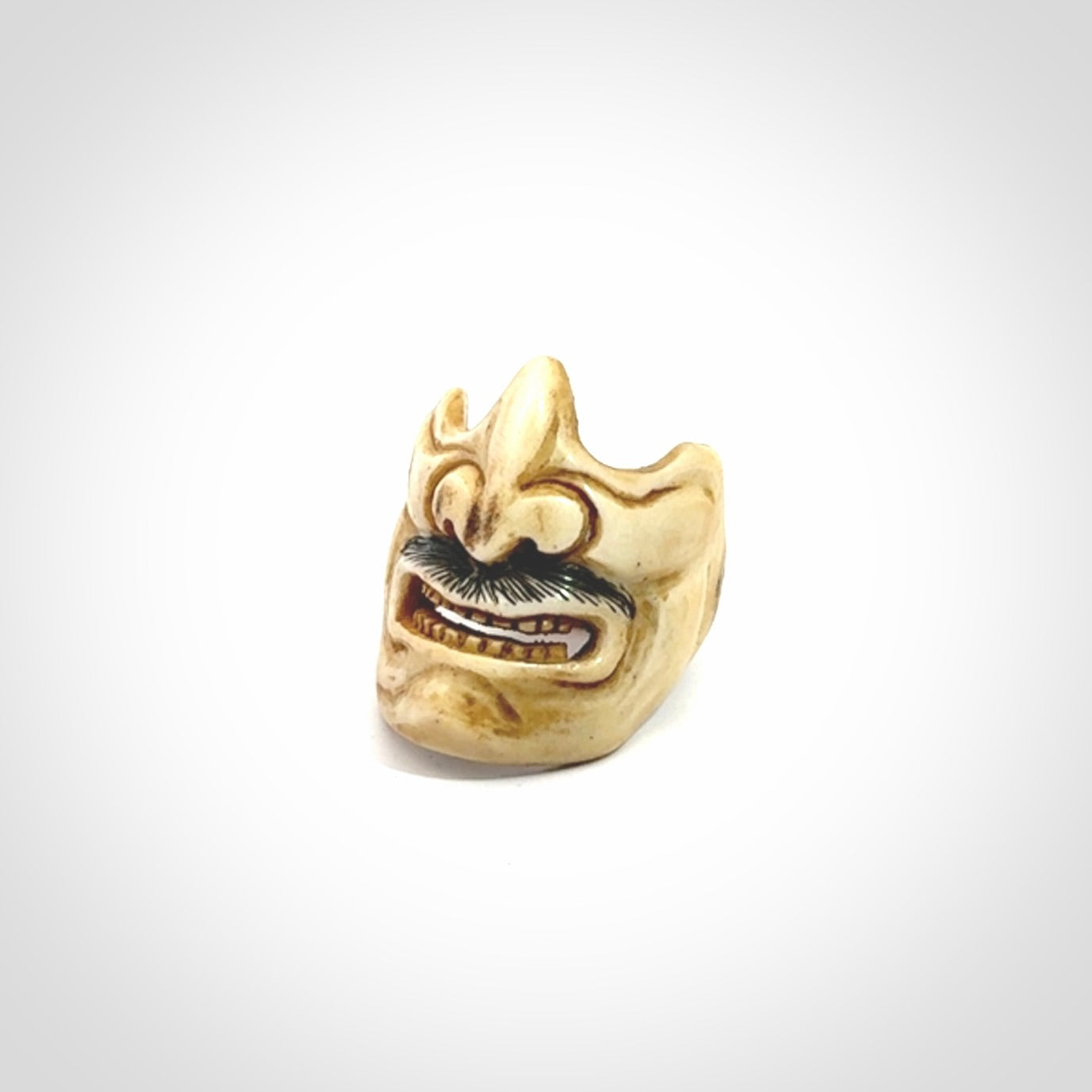 Hand carved Menpo samurai face guard ring. Made from Red Deer antler in New Zealand. Hand made from deer antler by master bone carver Fumio Noguchi. Spectacular collectable work of art, made to wear. One only ring, delivered to you with express courier.