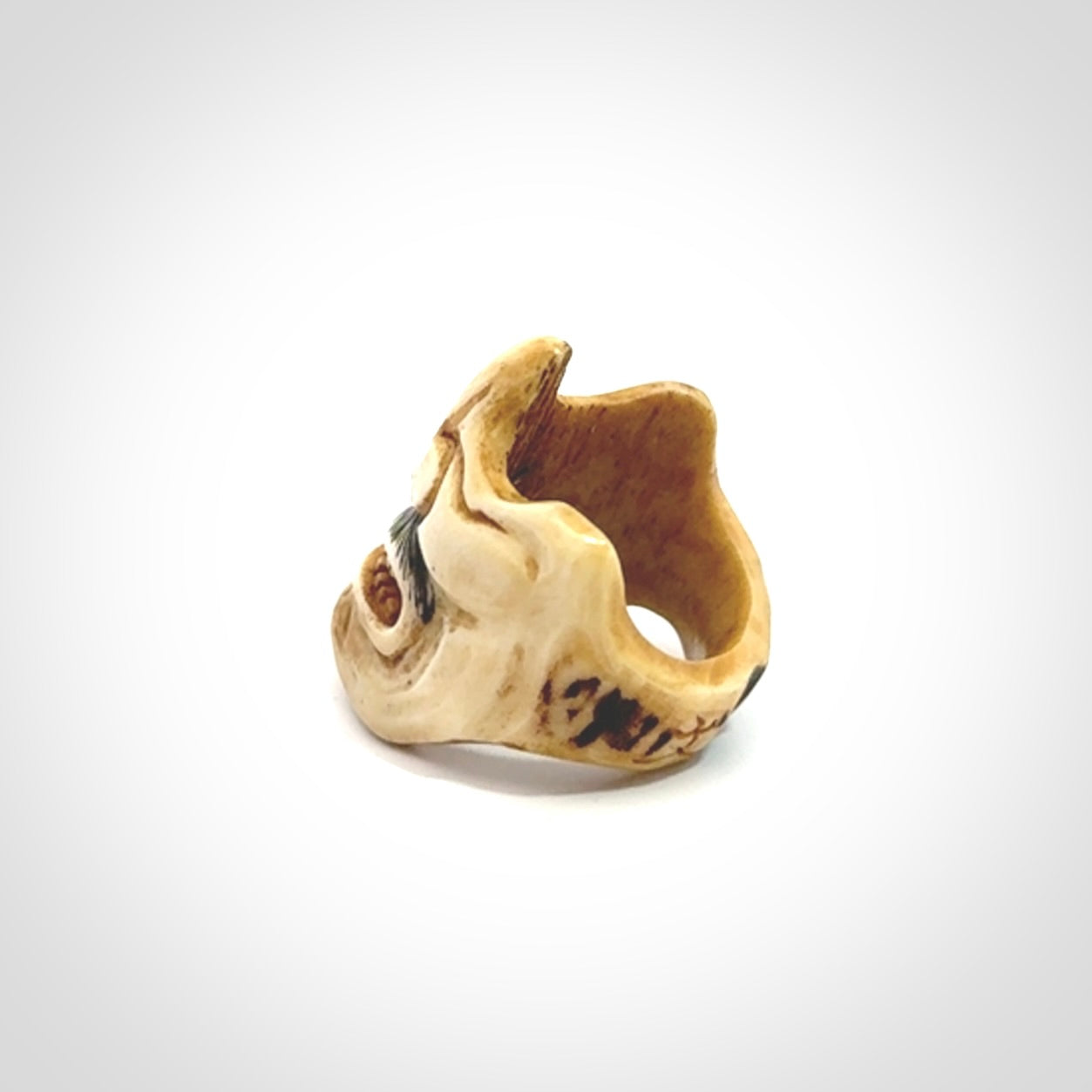 Hand carved Menpo samurai face guard ring. Made from Red Deer antler in New Zealand. Hand made from deer antler by master bone carver Fumio Noguchi. Spectacular collectable work of art, made to wear. One only ring, delivered to you with express courier.