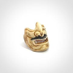 Hand carved Menpo samurai face guard ring. Made from Red Deer antler in New Zealand. Hand made from deer antler by master bone carver Fumio Noguchi. Spectacular collectable work of art, made to wear. One only ring, delivered to you with express courier.
