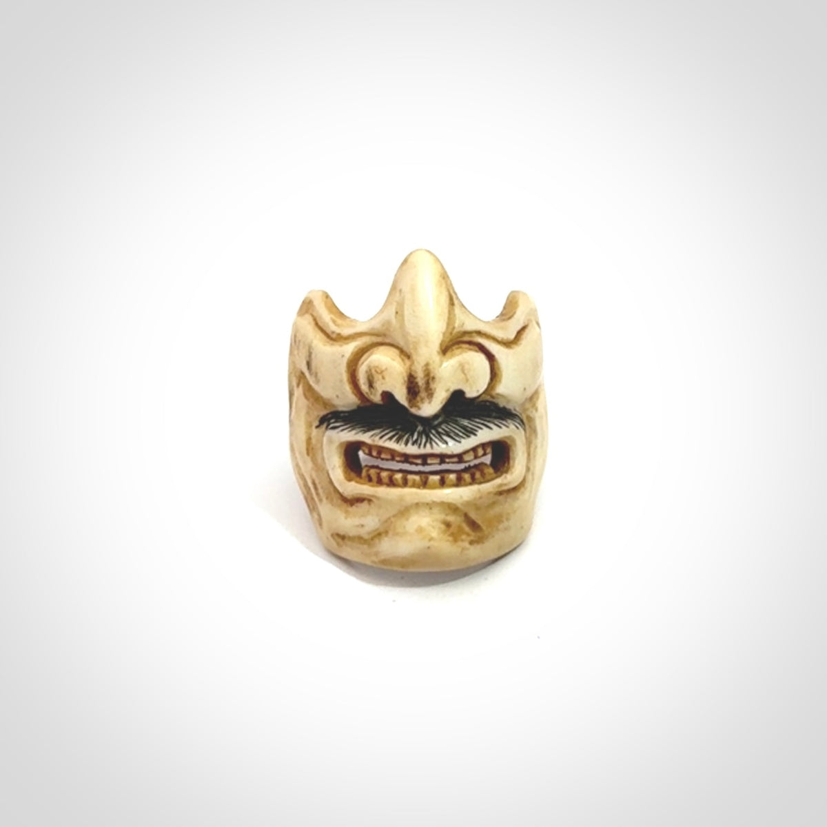 Hand carved Menpo samurai face guard ring. Made from Red Deer antler in New Zealand. Hand made from deer antler by master bone carver Fumio Noguchi. Spectacular collectable work of art, made to wear. One only ring, delivered to you with express courier.
