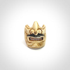 Hand carved Menpo samurai face guard ring. Made from Red Deer antler in New Zealand. Hand made from deer antler by master bone carver Fumio Noguchi. Spectacular collectable work of art, made to wear. One only ring, delivered to you with express courier.