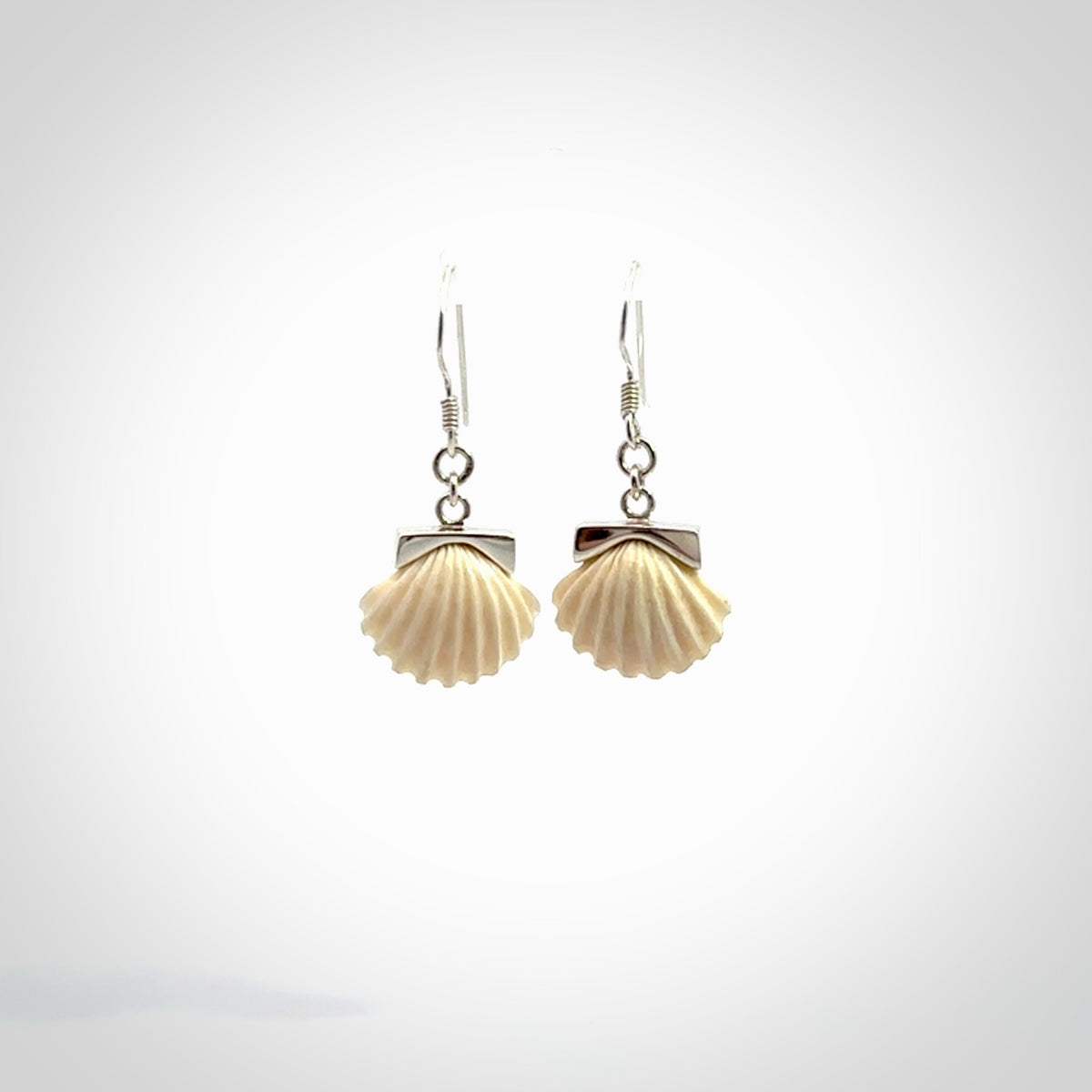 Hand made woolly mammoth tusk fanshell earrings with Sterling Silver. Mammoth tusk fanshell earrings with Sterling silver. Made by NZ Pacific and sale online only.