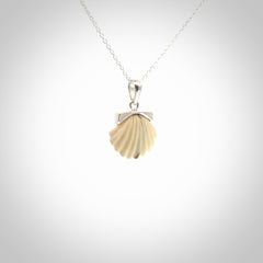 Hand made woolly mammoth tusk fanshell necklace with Sterling Silver. Mammoth tusk fanshell pendant with Sterling silver surround and chain. Made by NZ Pacific and sale online only.