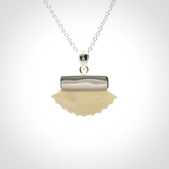 Hand made woolly mammoth tusk fanshell necklace with Sterling Silver. Mammoth tusk fanshell pendant with Sterling silver surround and chain. Made by NZ Pacific and sale online only.