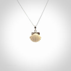 Hand made woolly mammoth tusk fanshell necklace with Sterling Silver. Mammoth tusk fanshell pendant with Sterling silver surround and chain. Made by NZ Pacific and sale online only.