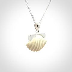 Hand made woolly mammoth tusk fanshell necklace with Sterling Silver. Mammoth tusk fanshell pendant with Sterling silver surround and chain. Made by NZ Pacific and sale online only.