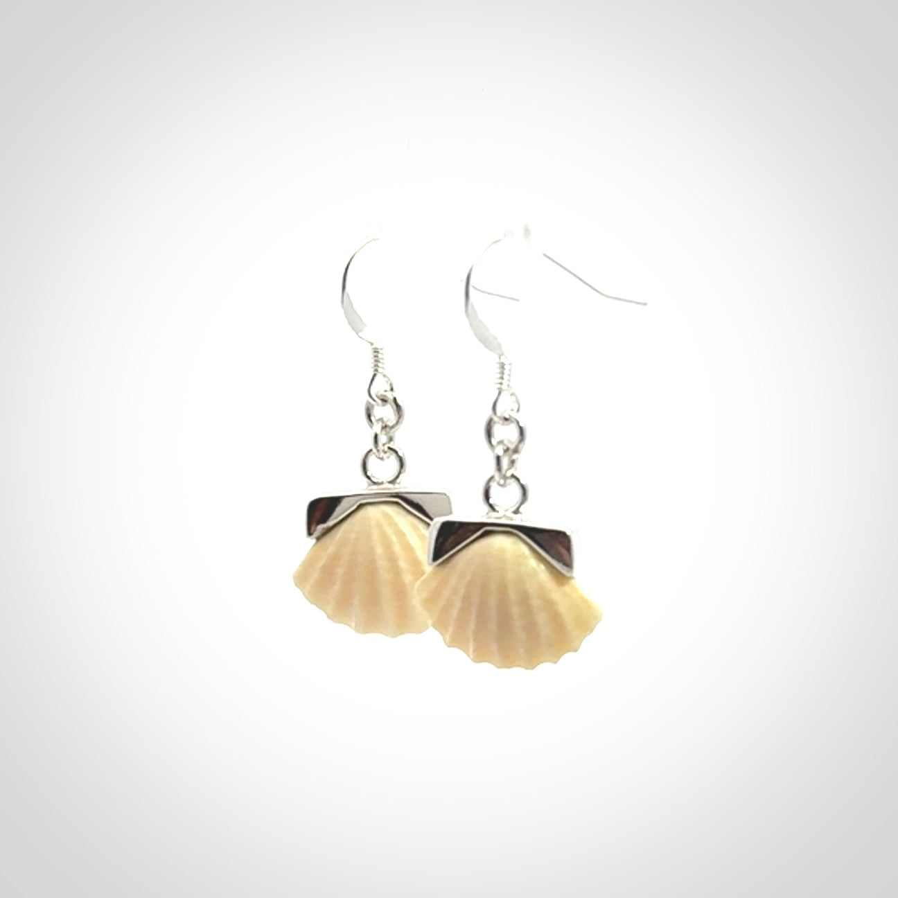 Hand made woolly mammoth tusk fanshell earrings with Sterling Silver. Mammoth tusk fanshell earrings with Sterling silver. Made by NZ Pacific and sale online only.