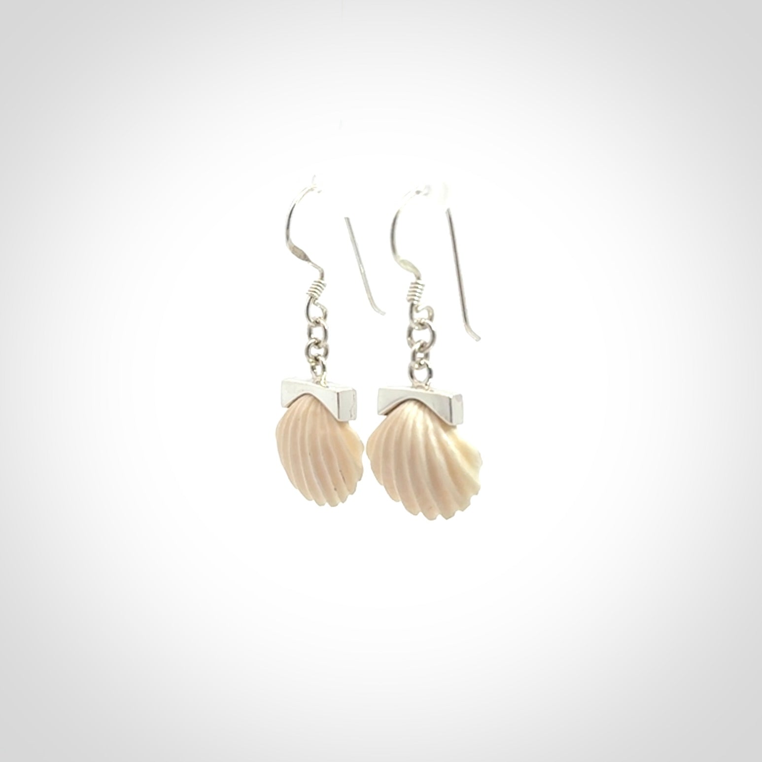 Hand made woolly mammoth tusk fanshell earrings with Sterling Silver. Mammoth tusk fanshell earrings with Sterling silver. Made by NZ Pacific and sale online only.