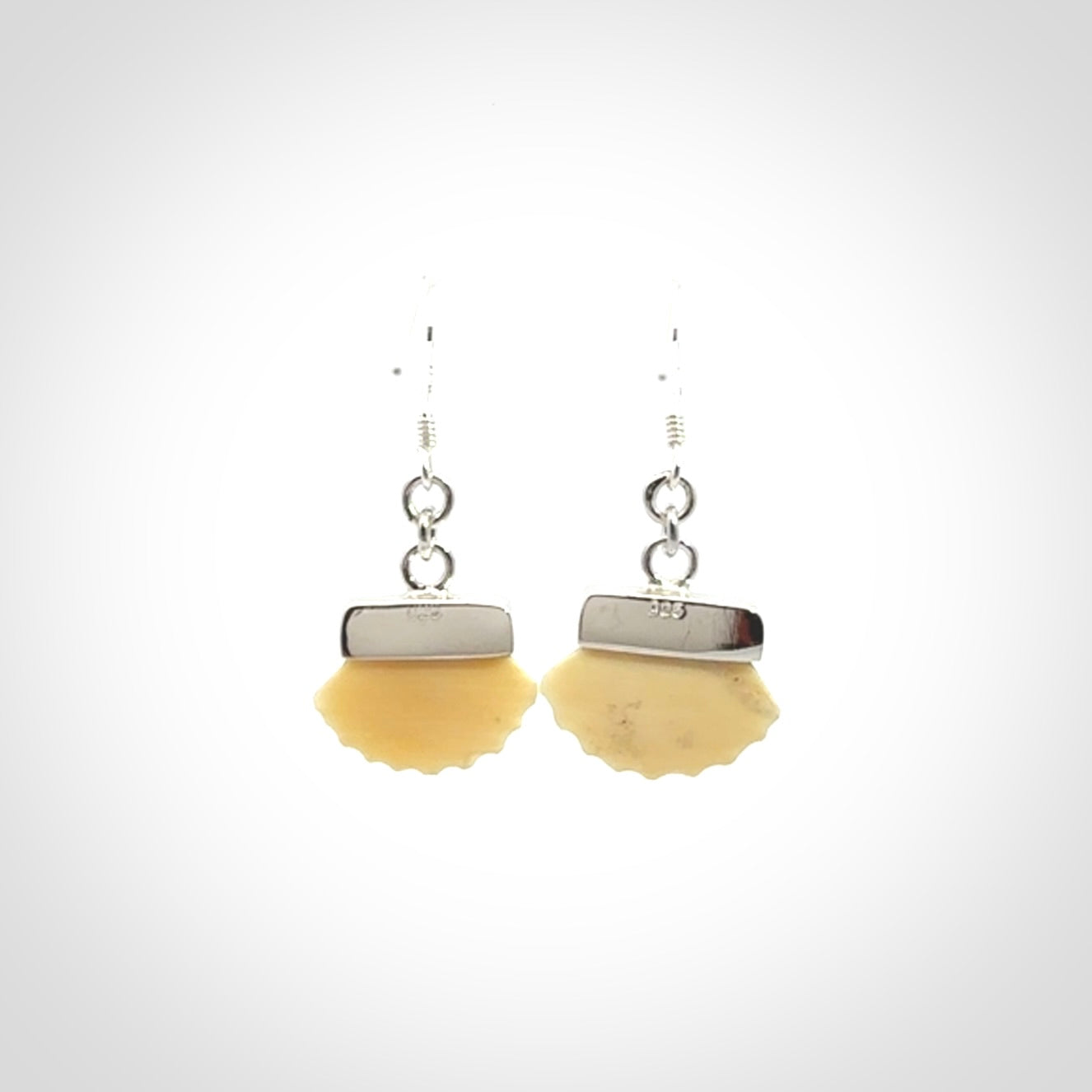 Hand made woolly mammoth tusk fanshell earrings with Sterling Silver. Mammoth tusk fanshell earrings with Sterling silver. Made by NZ Pacific and sale online only.