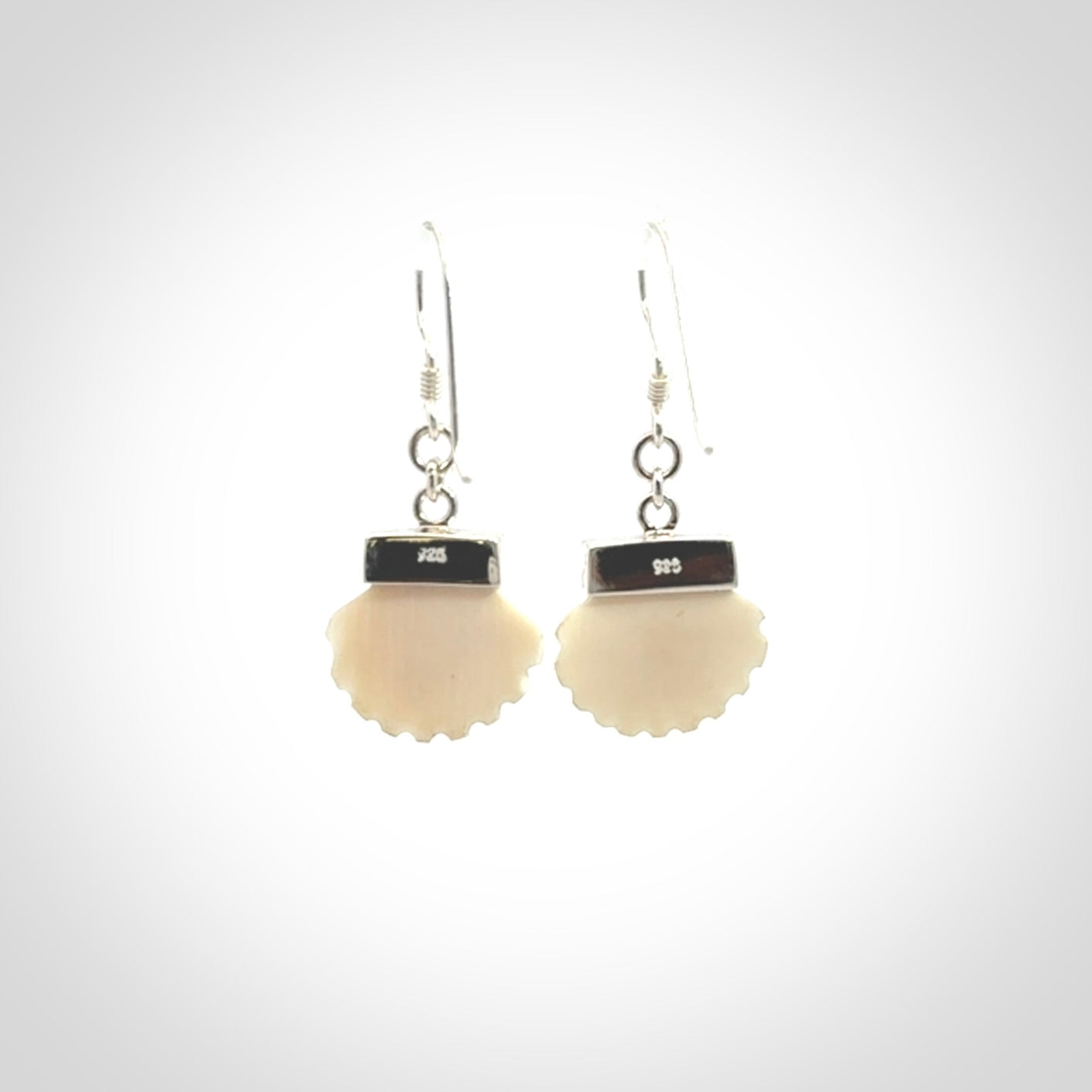 Hand made woolly mammoth tusk fanshell earrings with Sterling Silver. Mammoth tusk fanshell earrings with Sterling silver. Made by NZ Pacific and sale online only.