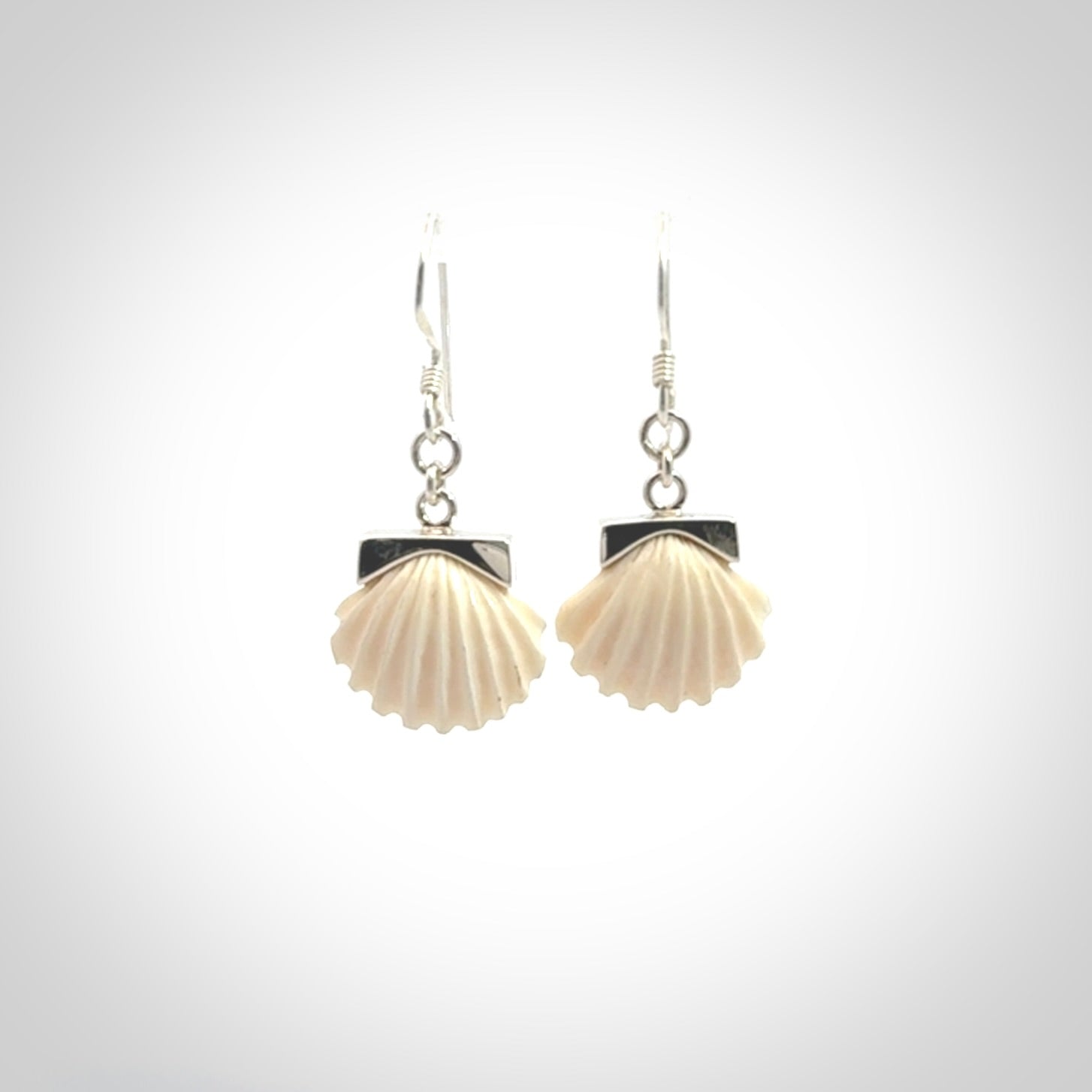 Hand made woolly mammoth tusk fanshell earrings with Sterling Silver. Mammoth tusk fanshell earrings with Sterling silver. Made by NZ Pacific and sale online only.