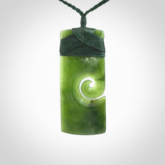 New Zealand jade toki koru pendant. Hand carved in New Zealand. Hand made jewellery. Provided with an adjustable cord.
