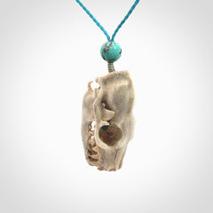 This is a hand carved deer antler cat skull pendant. It is made from deer antler, bone. This is a large sized necklace and is a very unique, one only, pendant that is a collectors piece. Hand carved deer antler cat skull necklace for men and women.