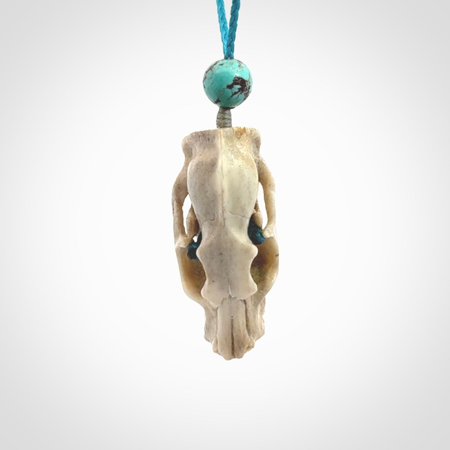 This is a hand carved deer antler cat skull pendant. It is made from deer antler, bone. This is a large sized necklace and is a very unique, one only, pendant that is a collectors piece. Hand carved deer antler cat skull necklace for men and women.