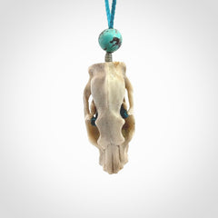 This is a hand carved deer antler cat skull pendant. It is made from deer antler, bone. This is a large sized necklace and is a very unique, one only, pendant that is a collectors piece. Hand carved deer antler cat skull necklace for men and women.